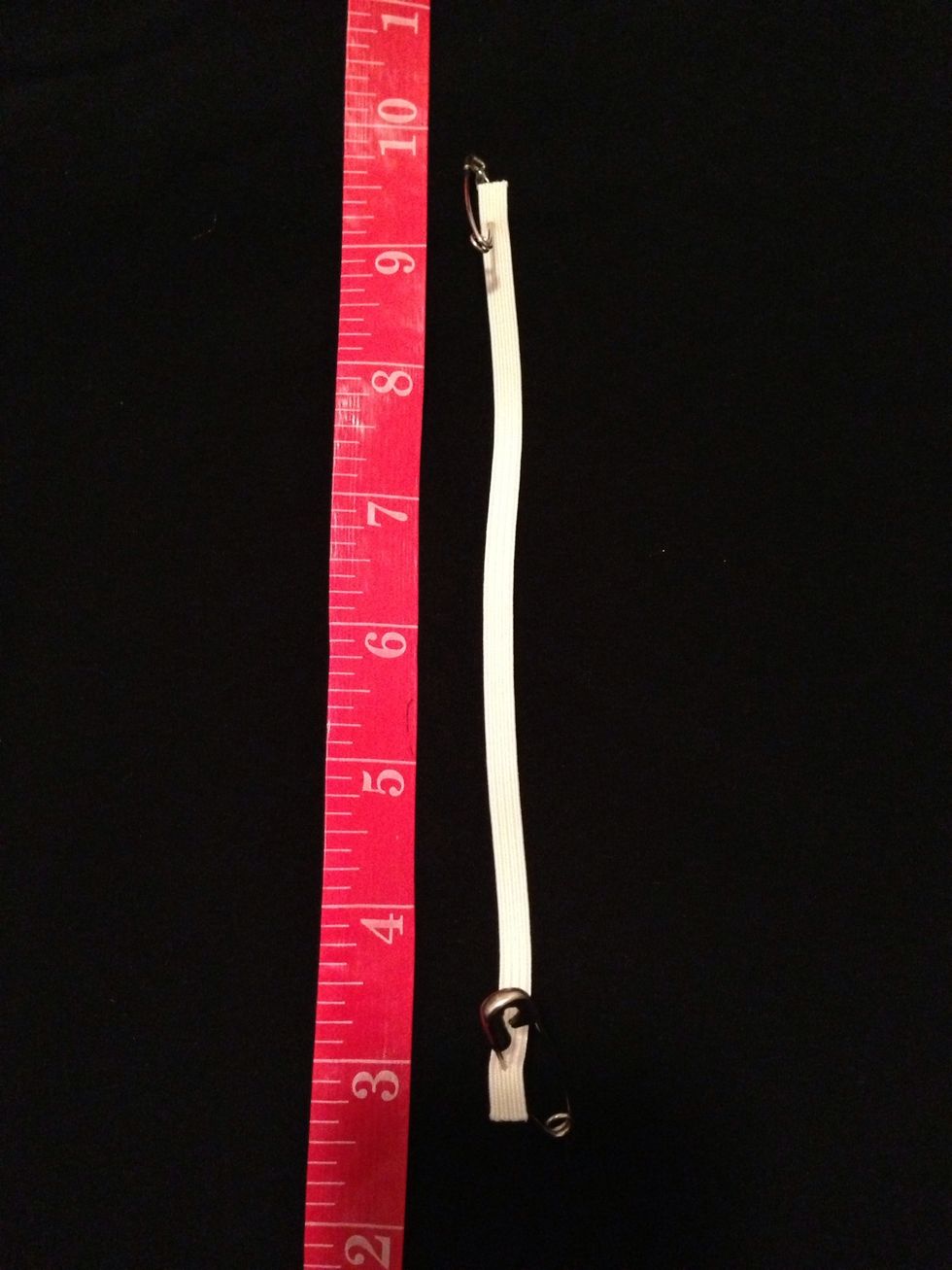Cut 2 strips of 1/4" wide elastic at 7" each. Add safety pins on both ends. This will guide elastic through the loops later.