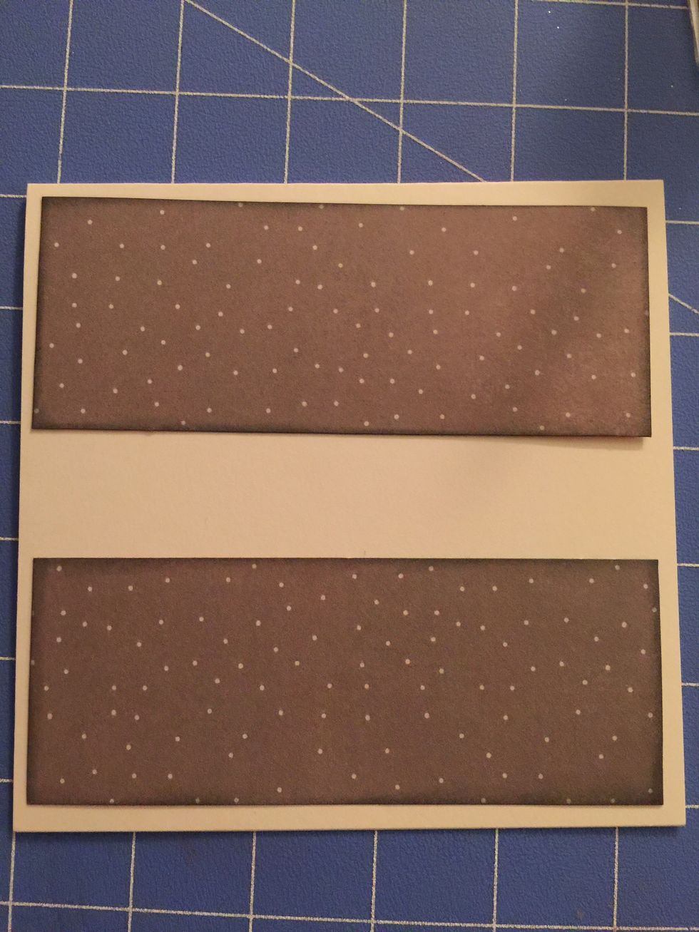 Cut 2 strips of the grey paper with the white dots, and cut them at 2" x 5 1/2. Distress Edges. Adhere to card at the top and bottom of the card, leaving an 1/8 inch of the card base showing.