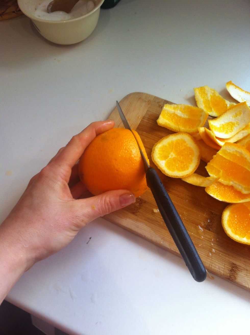 Cut 2 thin slices to garnish glasses