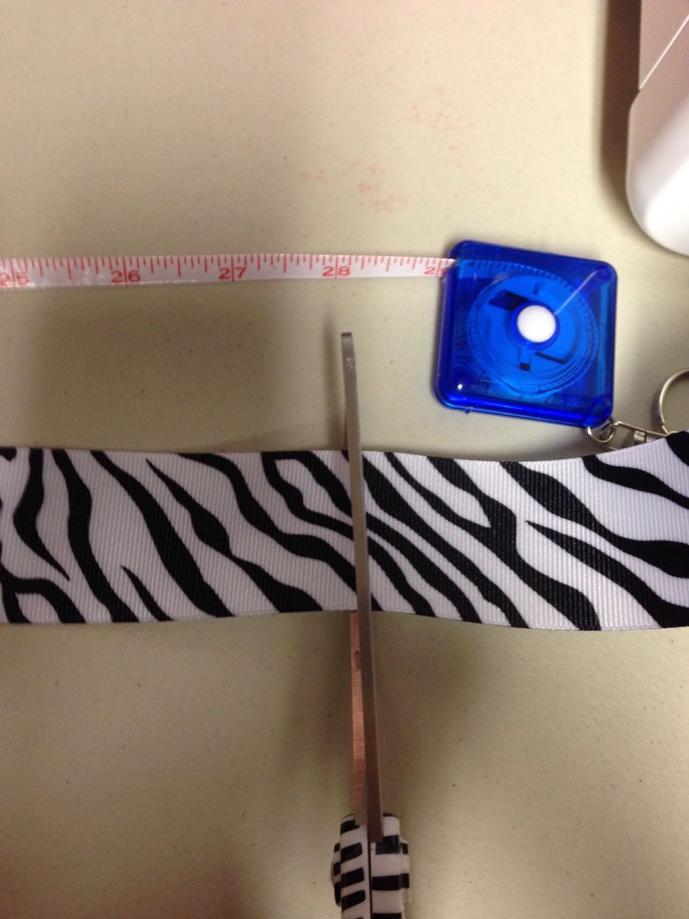 Cut 28 inches of ribbon. Heat seal