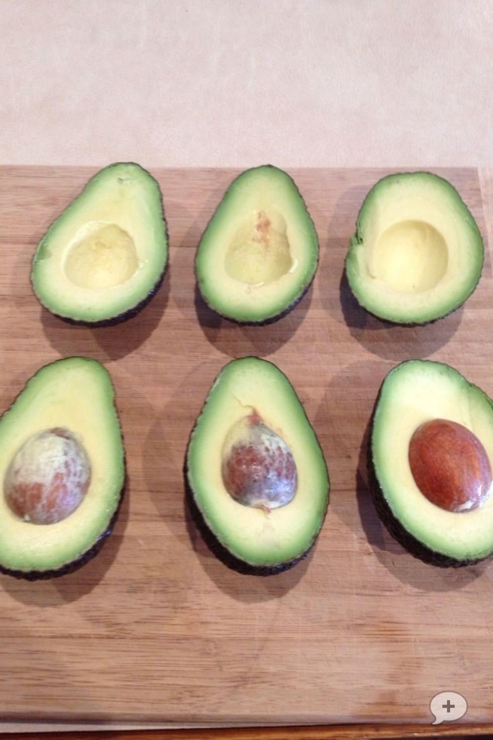 Cut 3 avocados in half