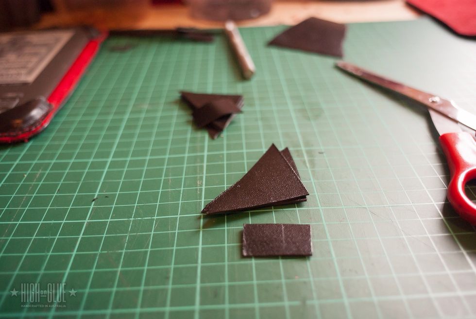 Cut 3 corners (from around 4.5cm squares) and one small rectangle from a piece of kangaroo leather