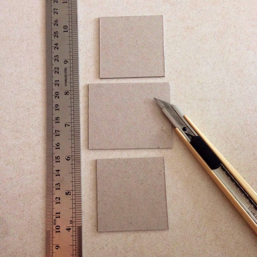 Cut 3 pieces chipboard into the following dimensions: 1 piece of 2.5" x 2" and 2 pieces of 2" x 2"...