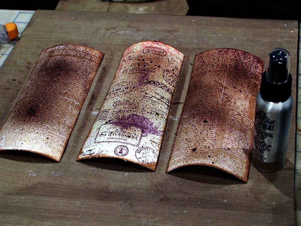 Cut 3 pieces of patterned paper, slightly smaller than your tag and mist each tag with Colorations - French Toast