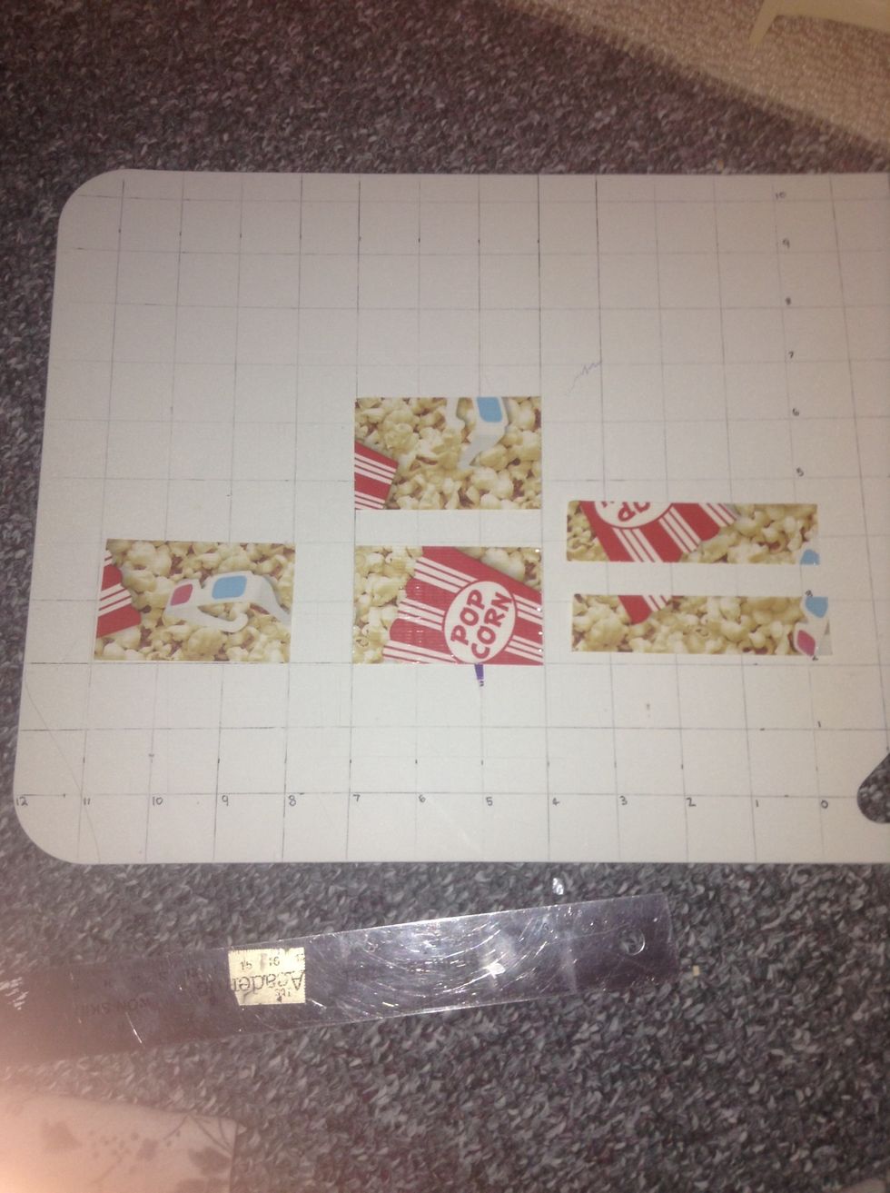 Cut 3 pieces of tape that are 3 inches and cut one that is 4 inches and cut only that one in half.