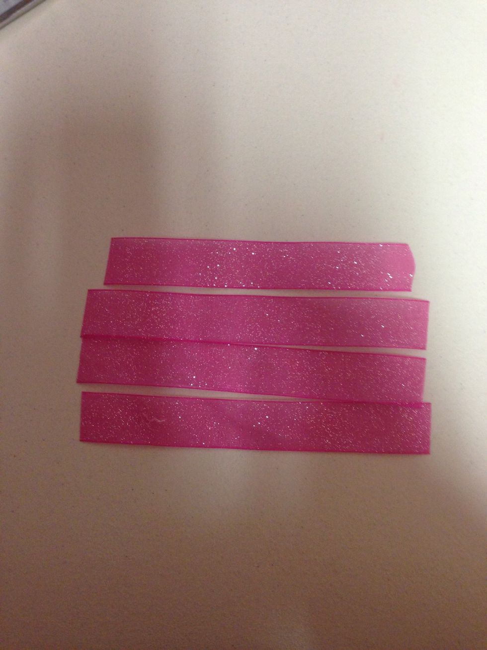 Cut 4, 6 1/2 inches of a different ribbon and heat seal