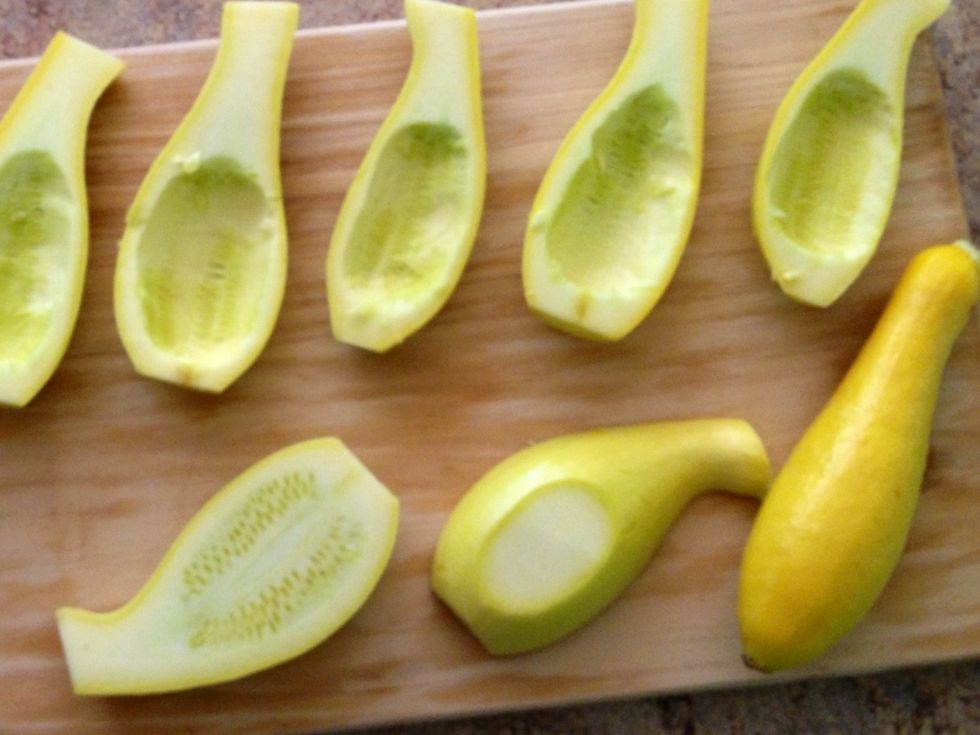 Cut 4 of the 5 squash. With a melon baller spoon out seeds. Take a bit off the bottom of each so it sits flush. Brush with olive oil, add salt & pepper and grill. Dice the remaining squash & reserve.