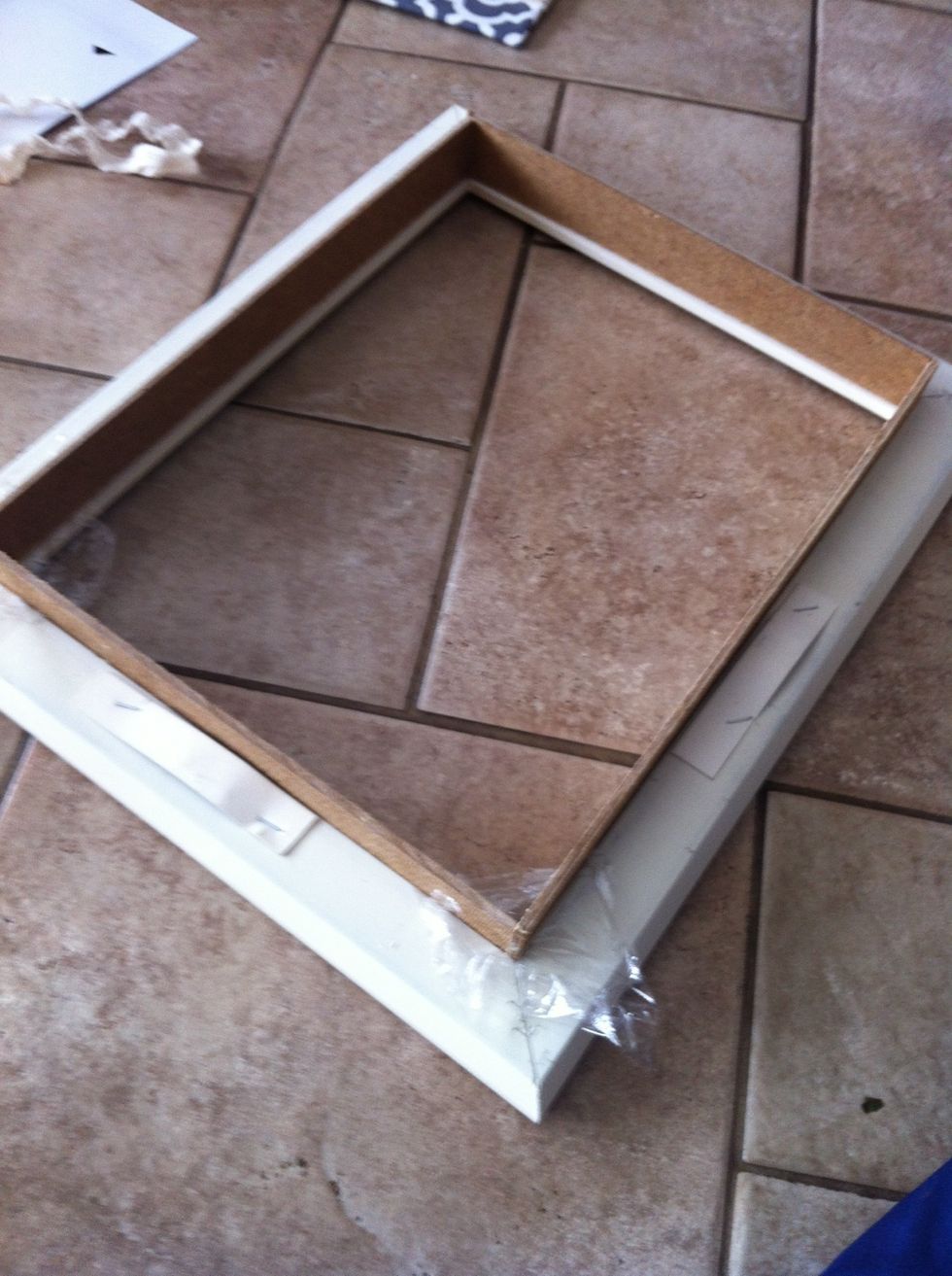 Cut 4 pieces of wood that fit into the frame and glue them together with wood glue (if you have questions feel free to ask)