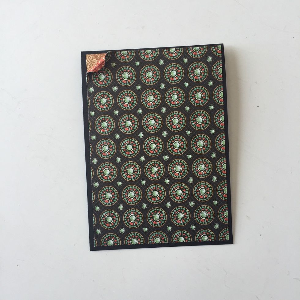 Cut 4" x 5 3/4"piece from Brilliant Gem. Gild edge with gold paint and layer on cardbase. Leave top left corner unglued to curl up. Add gold paint to back of curl, if desired.