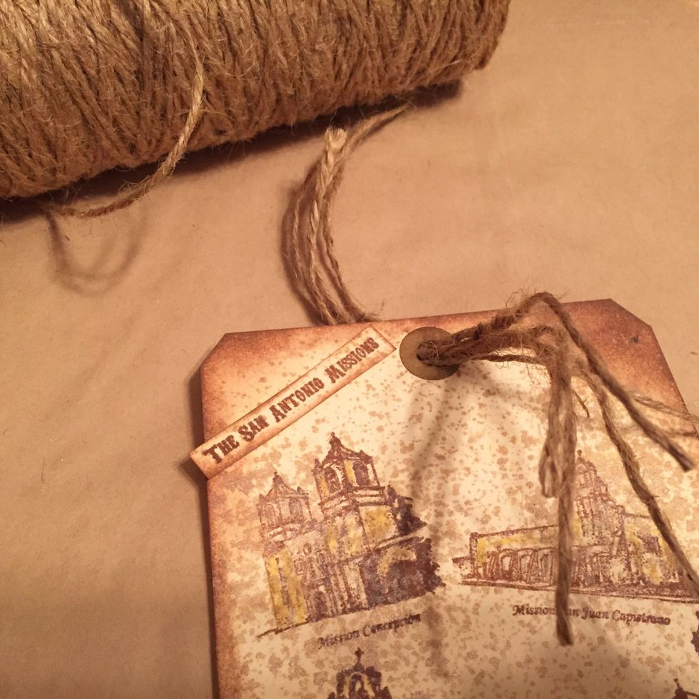 cut 5 pieces of jute and thread through hole in tag