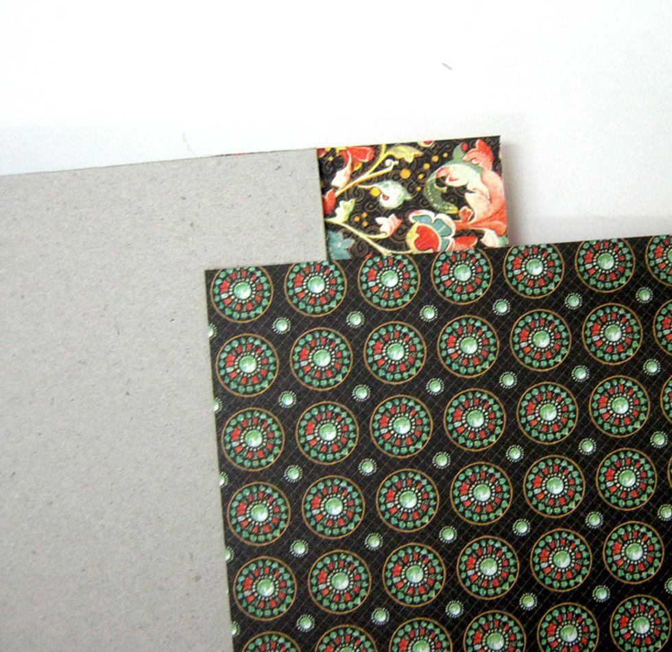 Cut 5"x8" piece from Brilliant Gem paper. Turn over book and adhere to bottom of chipboard covering 1" on each side.