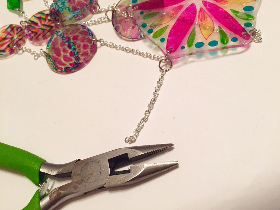 cut 6 - 1 1/4" piece of chain and use small jump rings to attach them in each hole of top.