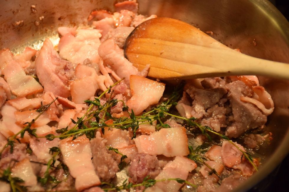 Cut 6 bacon slices into 1" pieces. In a frypan over medium high heat add a few sprigs of thyme, cook bacon and sausage together.  Constantly mix to break up sausage.