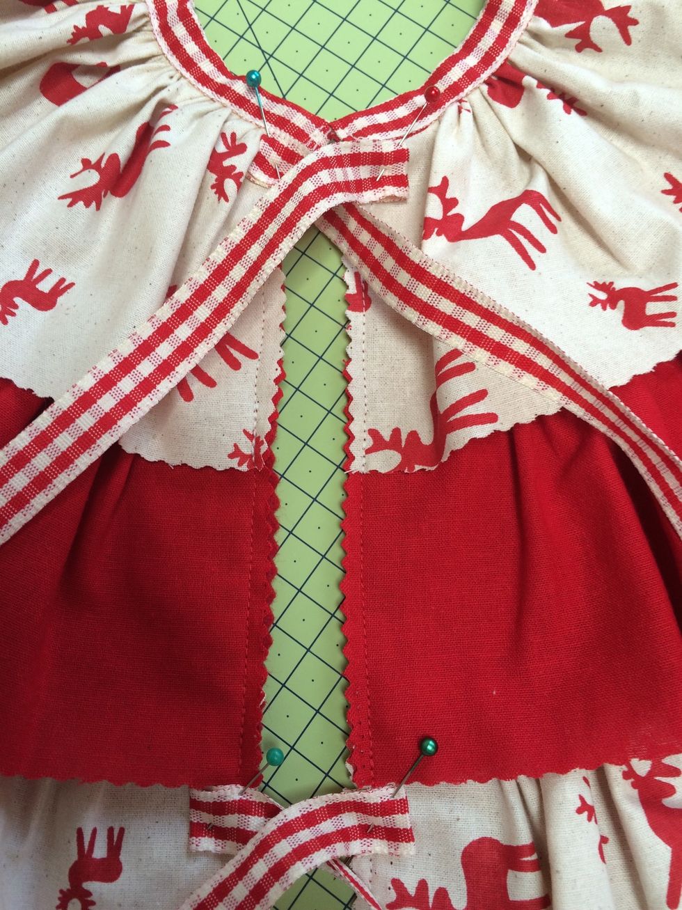 Cut 6 x 12 inches of ribbon and sew in 3 sets either side of opening