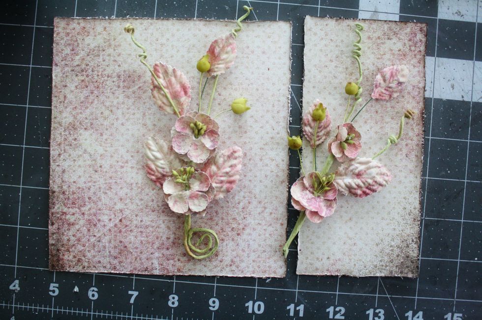 Cut 6"x 6.5" and 3.25"x 6.5" from pattern paper to adhere to cover. Be sure to distress edges. Take a Prima Flower Vine(from flower add-n) and cut on half.