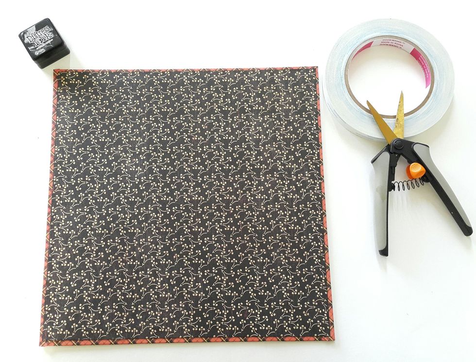 Cut 9 \u00be\u201d x 9 \u00be\u201d selected \u201cAn ABC Primer\u201d paper and cover the back, the box cover is ready to decorate.