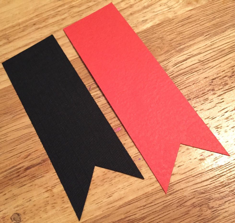 cut a 1 1/2 X 4 1/2 piece of black cardstock and a 1 1/2 X 5 piece of red cardstock. dovetail one end of each piece.