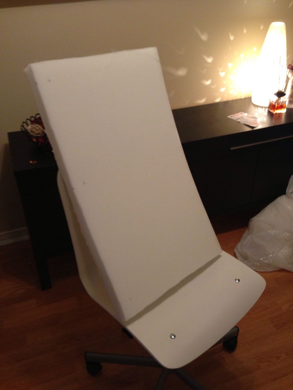 Cut a 17" x 28" piece of foam. It will be about the same width of the chair. Use a blade to cut the foam.