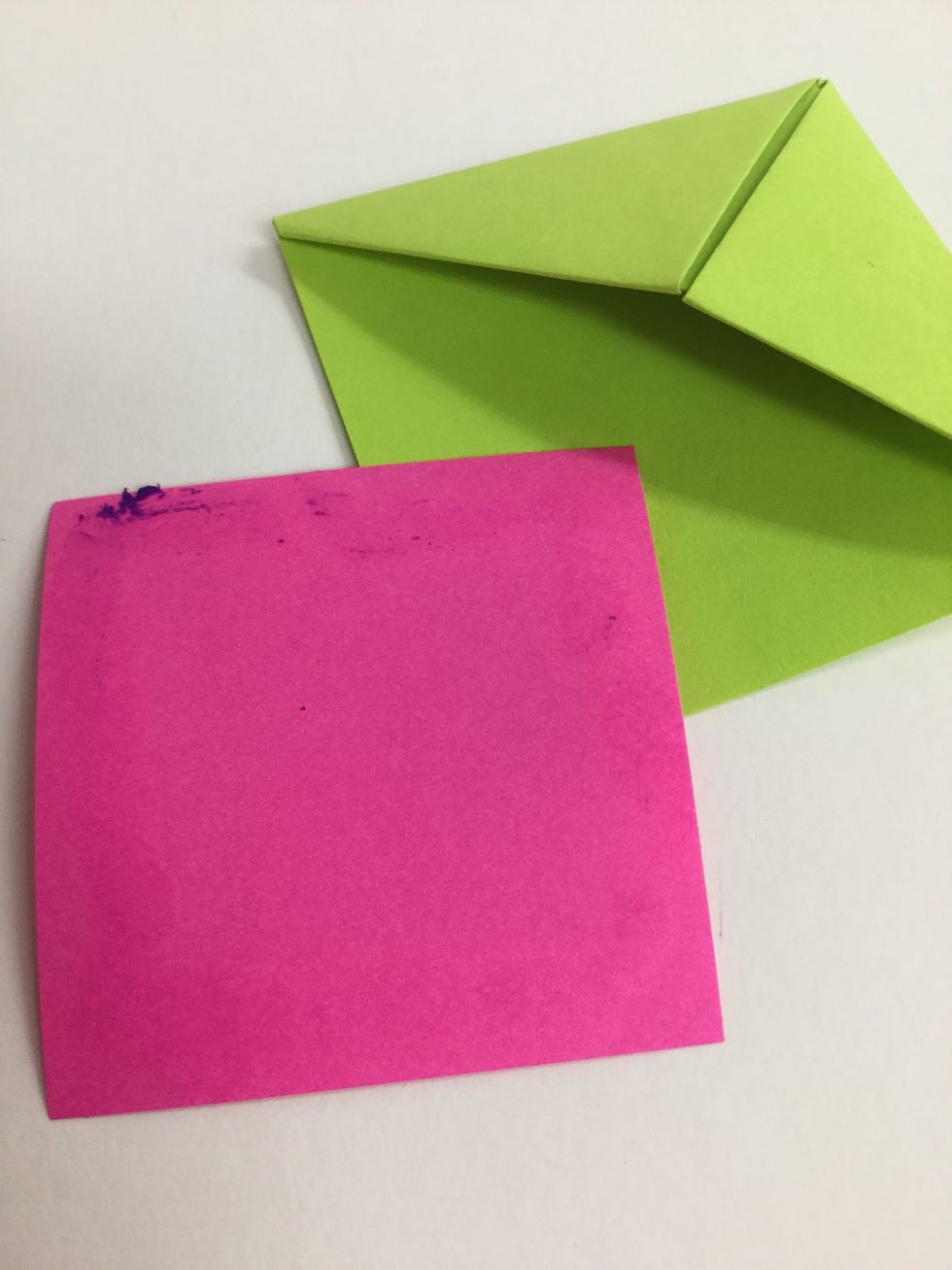 Cut a 2-1/2" square of a contrasting color paper. Put glue around the edges.