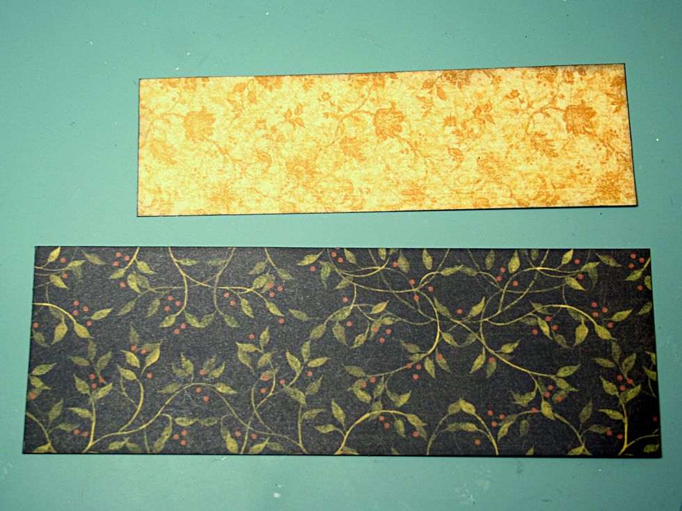 Cut a 2 x 8.25" piece from Secret Garden and a 1.5 x 6.75" piece from Summer Sonata. Ink the edges of both pieces.