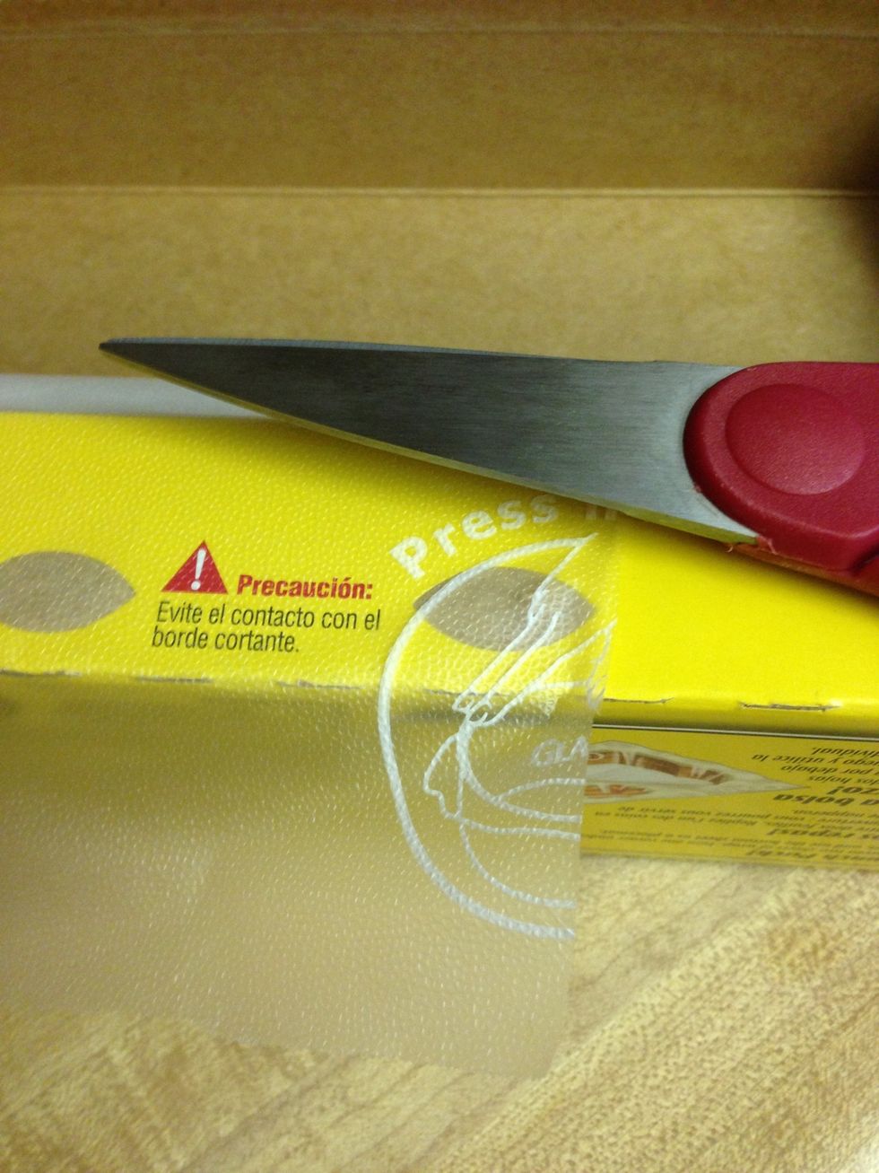 Cut a 3 inch square of plastic wrap