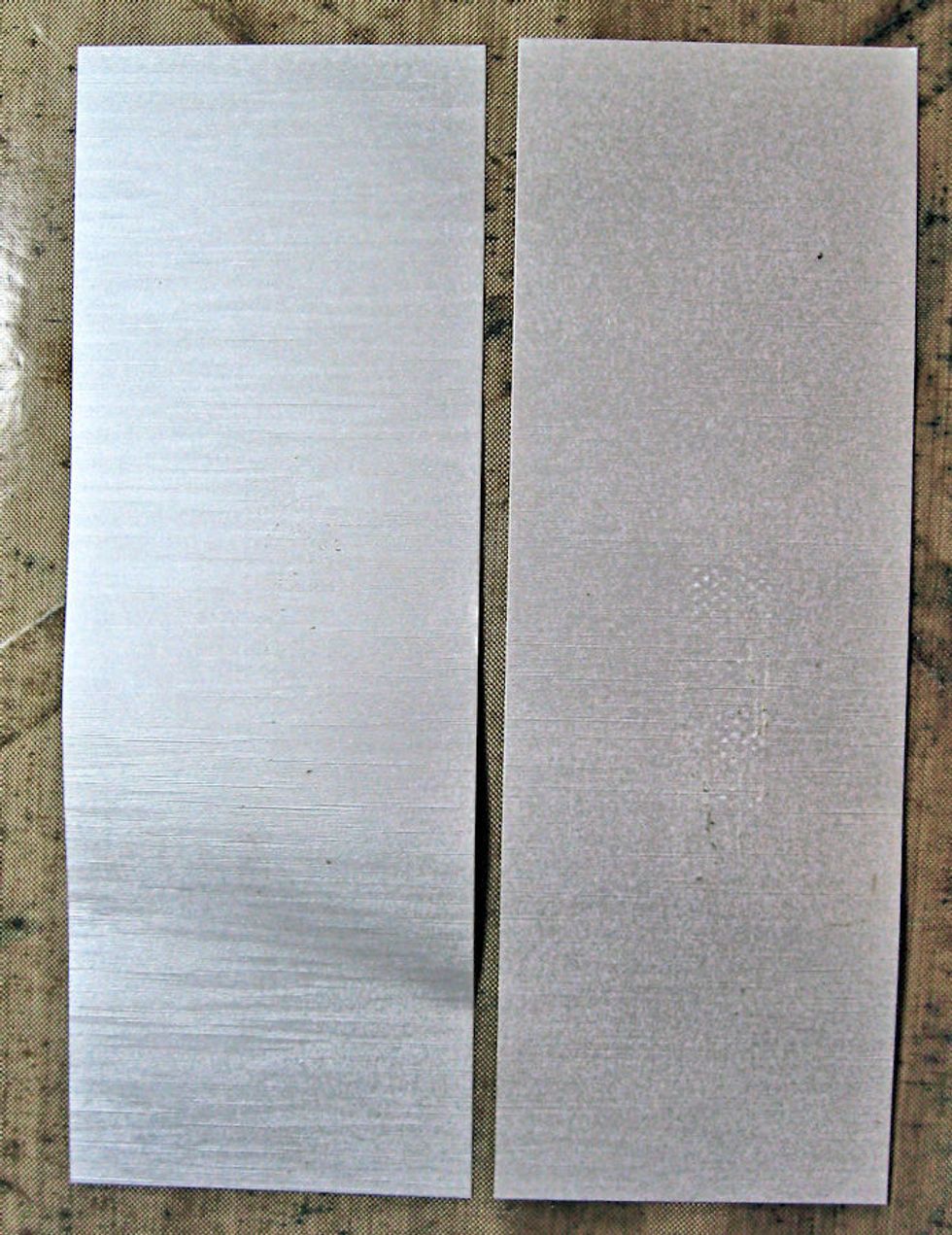 Cut a 4 7/8" x 67/8" rectangle from brushed silver metallic cardstock. Cut in half from top to bottom to create two long rectangles that will be the mat for the card front. Don't glue yet!