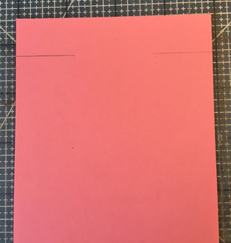 Cut a 4" x 9" tag from colored card stock. Mark 3/4" down from top edge.