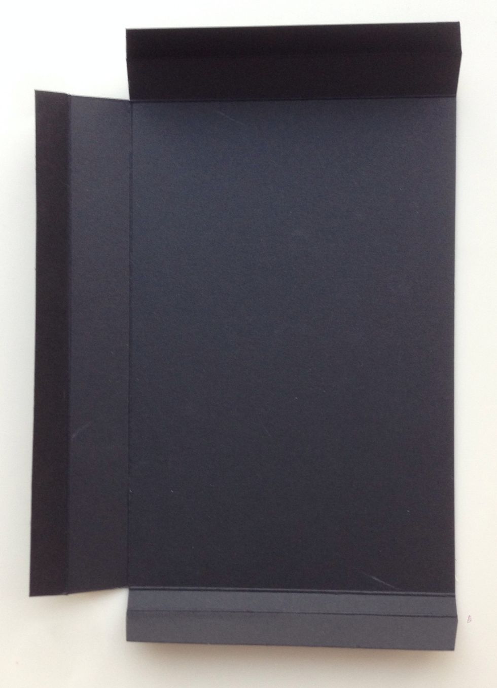 Cut a 5 1/4" x 7 3/4" rectangle of Card Stock. Score 1/2" and 1" from top edge. Score 1/2" and 1 1/4" from left side. Score 1/2" and 3/4" from bottom edge. Trim away all corners as shown.