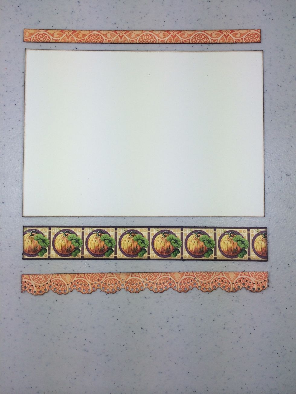 Cut a 6 3/4" x 4 3/4" piece of cream cardstock then cut a few 6 3/4" strips as you like from various papers in the collection. Ink all edges.