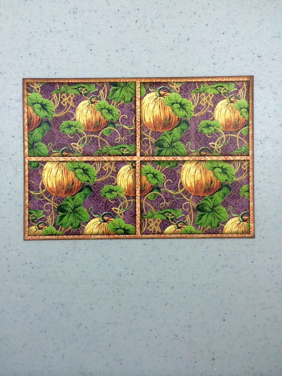 Cut a 6 3/4" x 4 3/4" piece of "Grand Illusion" paper as your base. Cut four 3 3/16" x 2 3/16" pieces of "Abracadabra" paper. Ink all edges with a brown ink. Adhere together as shown.