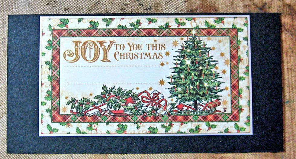 Cut a 6" wide x 3" high rectangle of black cardstock. Mat sentiment so that there is a 1/8" border on top and the image is centered with a 1/2" border on either side. The bottom border is .25".