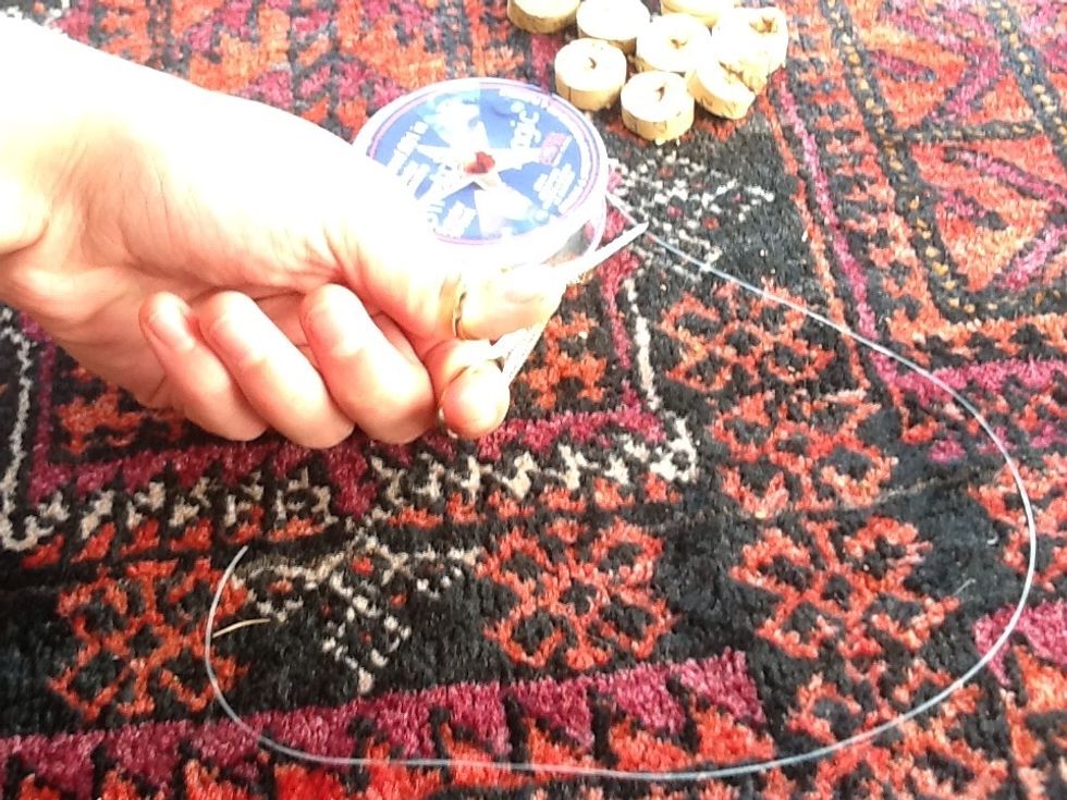 Cut a big piece of strechy thread.