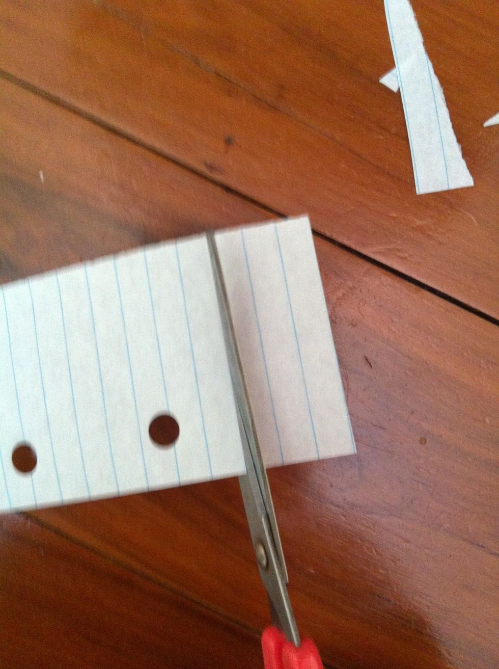 Cut a bit of paper in about this shape, if u hav lined paper then that's even better