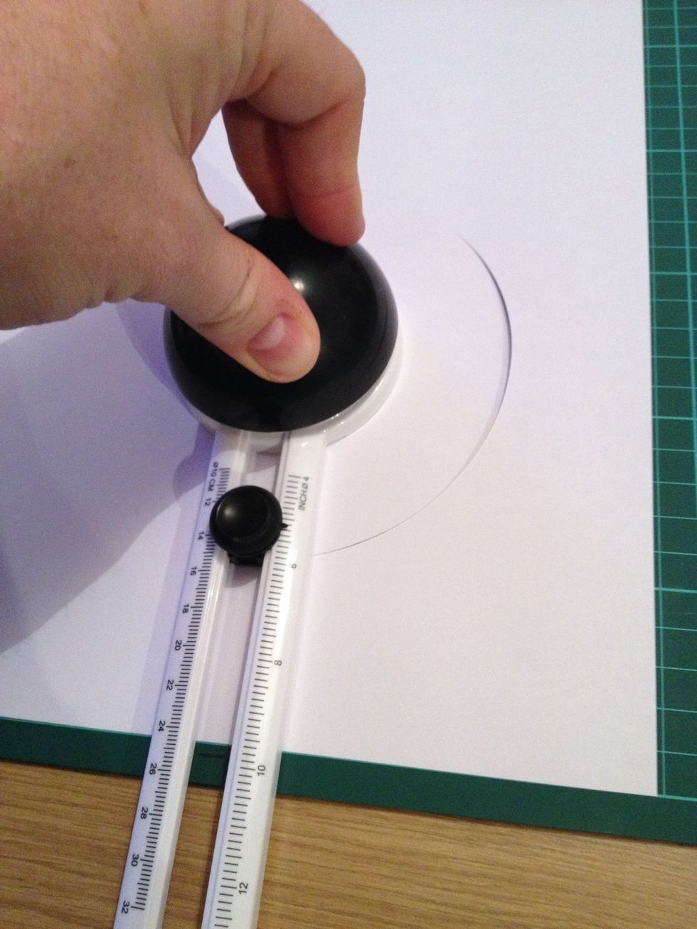 Cut a circle in each sheet of card to desired size
