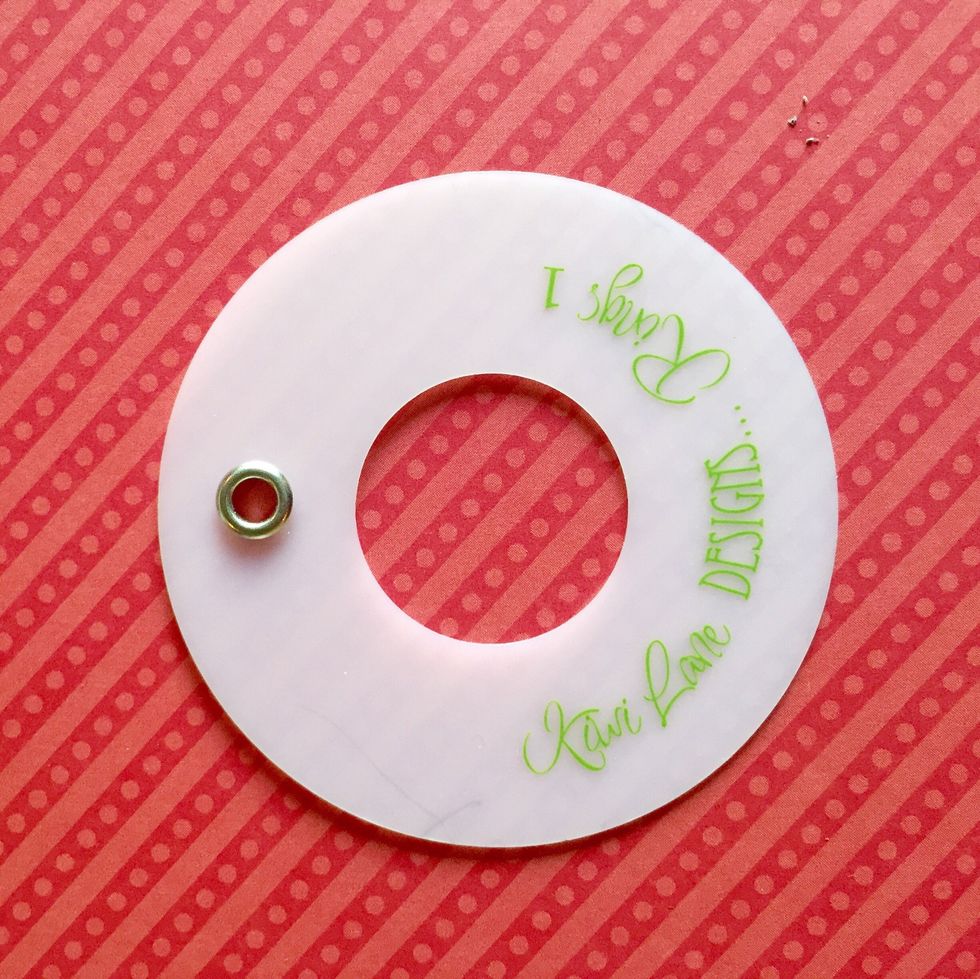 Cut a circle out of white card stock. I used Rings #1