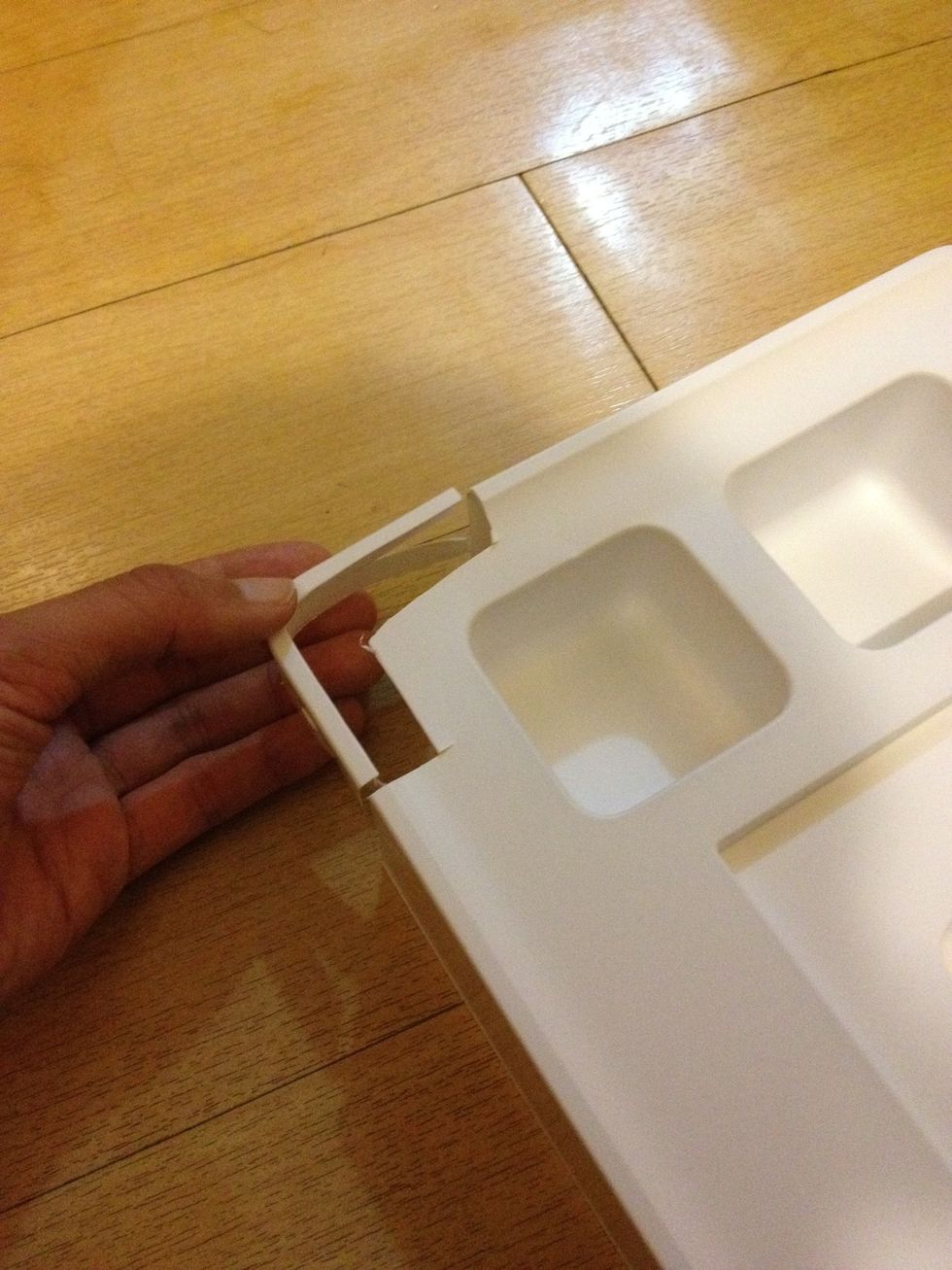 Cut a corner from an iPad box insert (the corners of the insert are of exactly the same angle as those of the iPhone!).