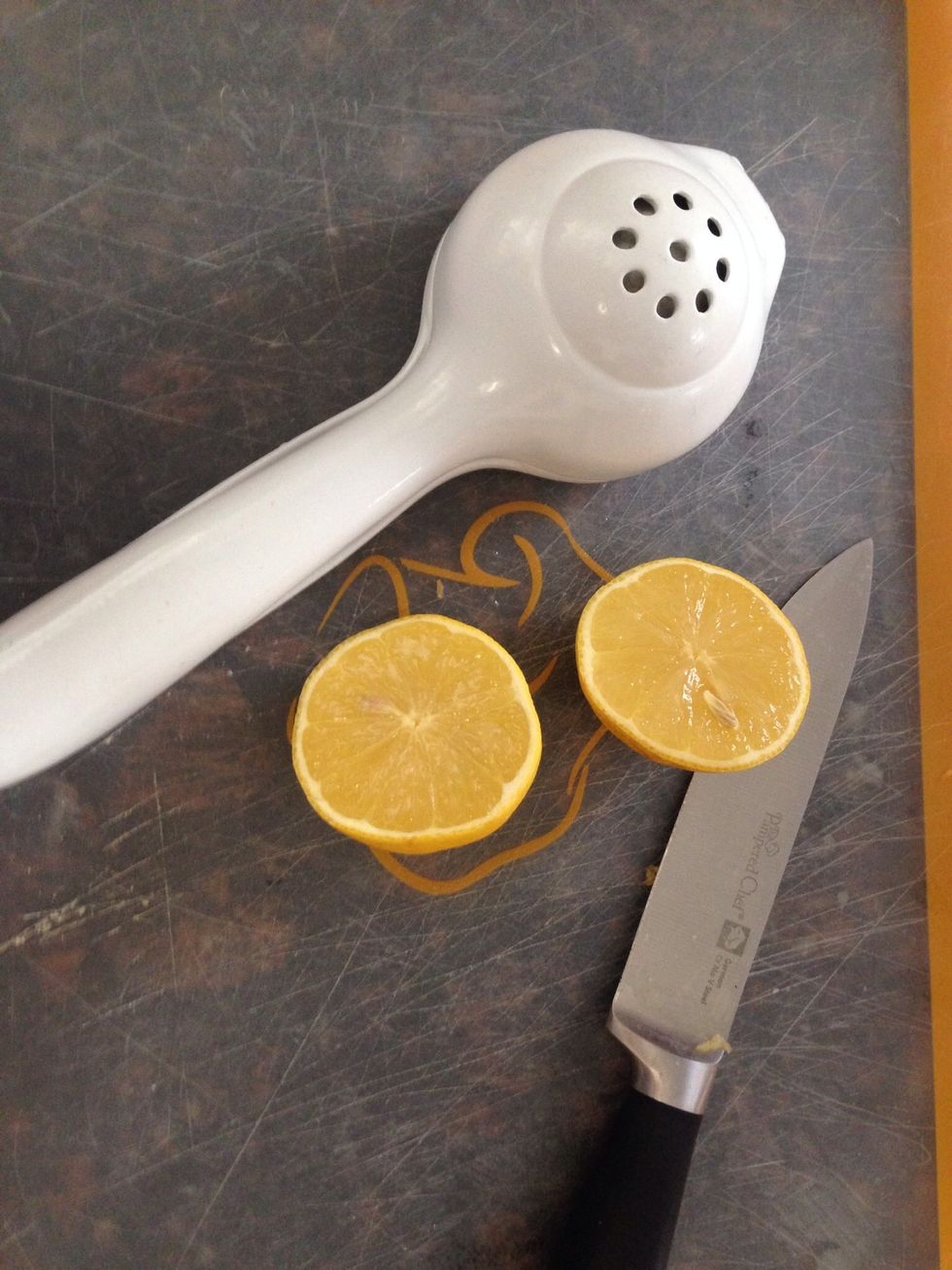 Cut a fresh lemon in half.