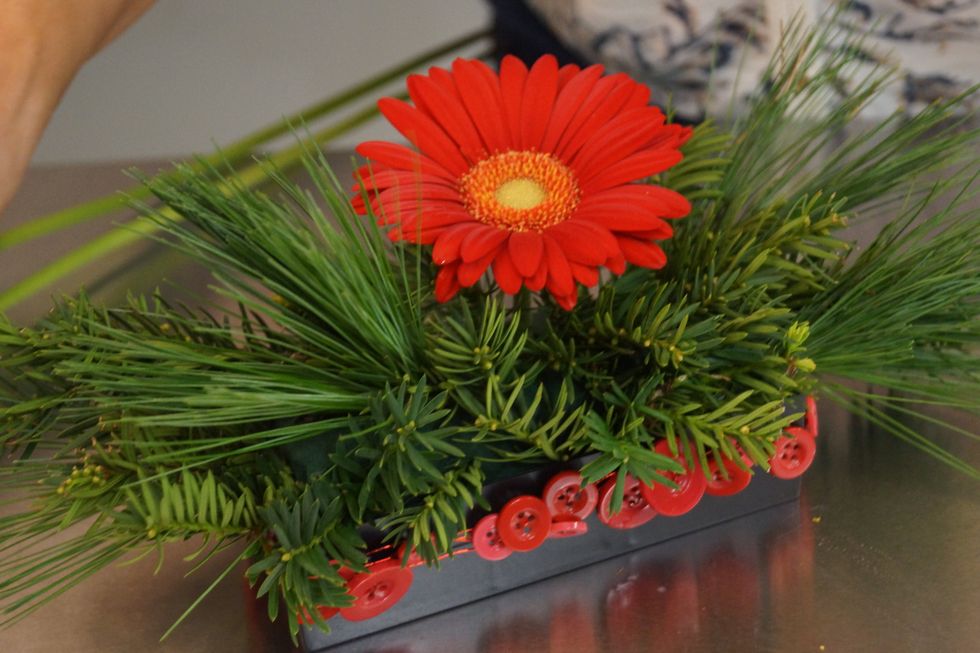 Cut a gerbera and insert into the top center of the foam.