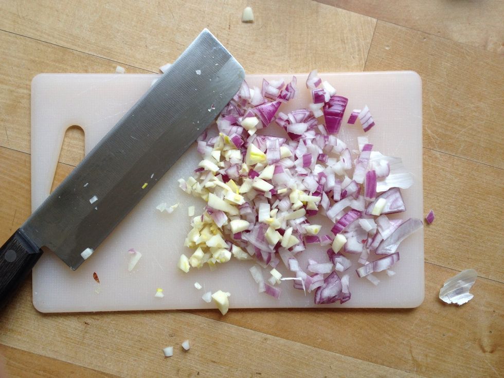 Cut a half onion and a piece of garlic in little pieces.
