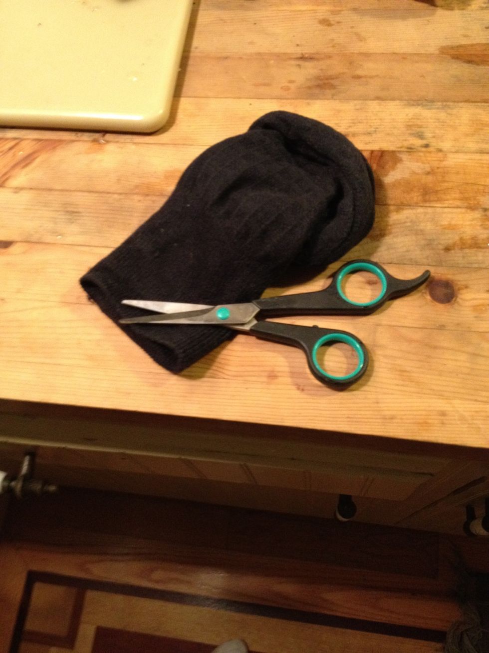 Cut a hole in a sock.