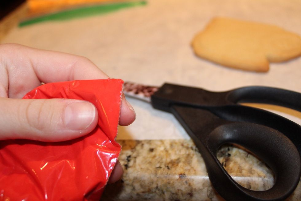 Cut a hole in the corner of the plastic bag