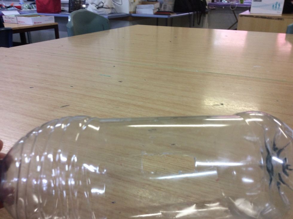 Cut a hole into your water bottle whatever size you want.