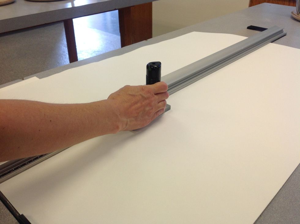 Cut a long strip of paper that will become your pages.