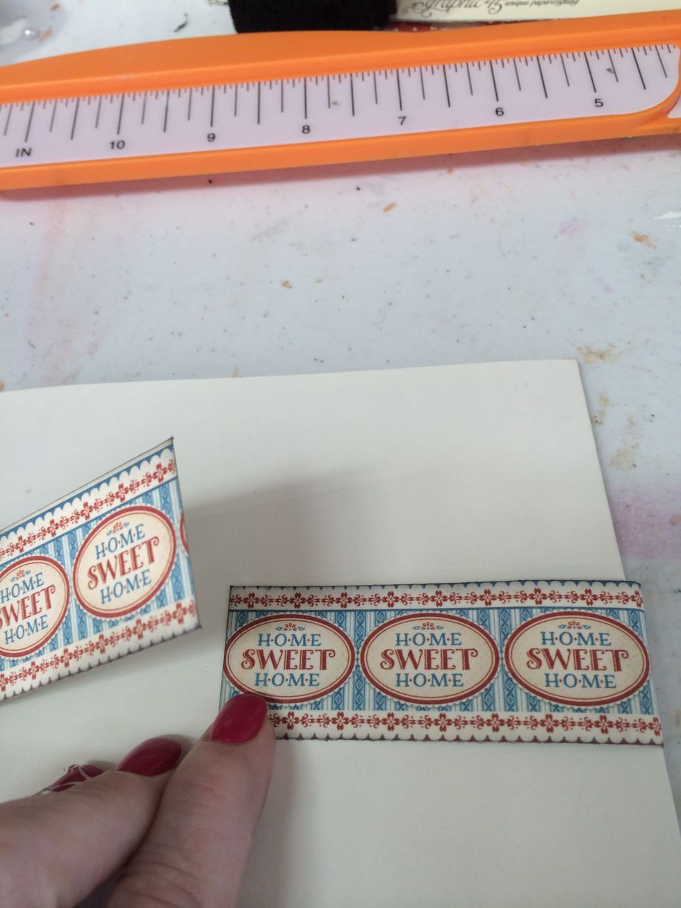 Cut a piece of approximately 2 x 12" piece of cardstock to create the belly band. I used Graphic 45's Home Sweet Home "Country Life" cardstock.