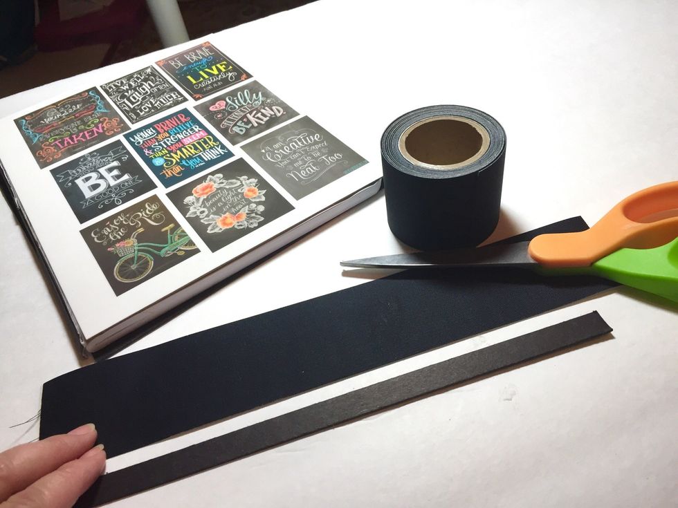 cut a piece of book binding tape about an 1" longer than your spine piece.