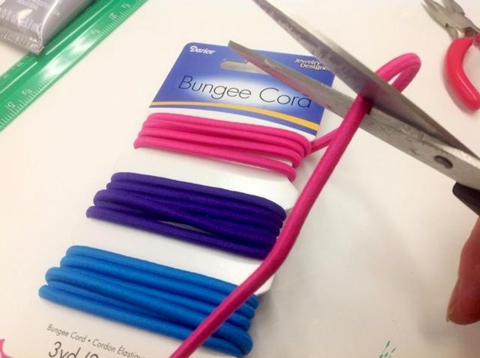 Cut a piece of bungee cord to fit your wrist minus the width of your closure.