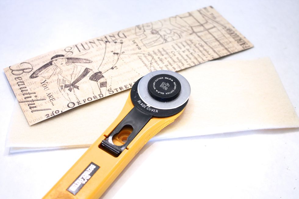 cut a piece of cardstock or thick paper 3 inches by 9 inches, use it a template to cut our your felt giving it an extra 1/8 inch around all sides- double up the felt. A rotary cutter works best