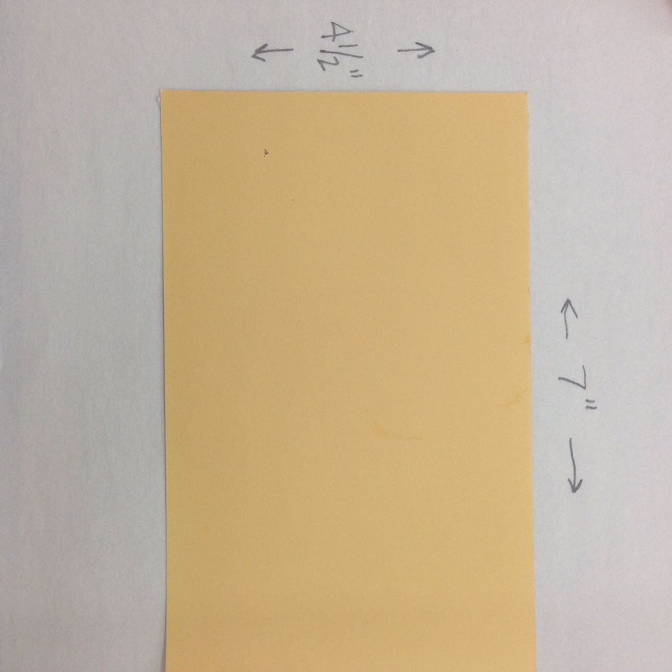 Cut a piece of heavyweight scrapbook paper to measure 4.5" x 7". This will be the main piece of the house.