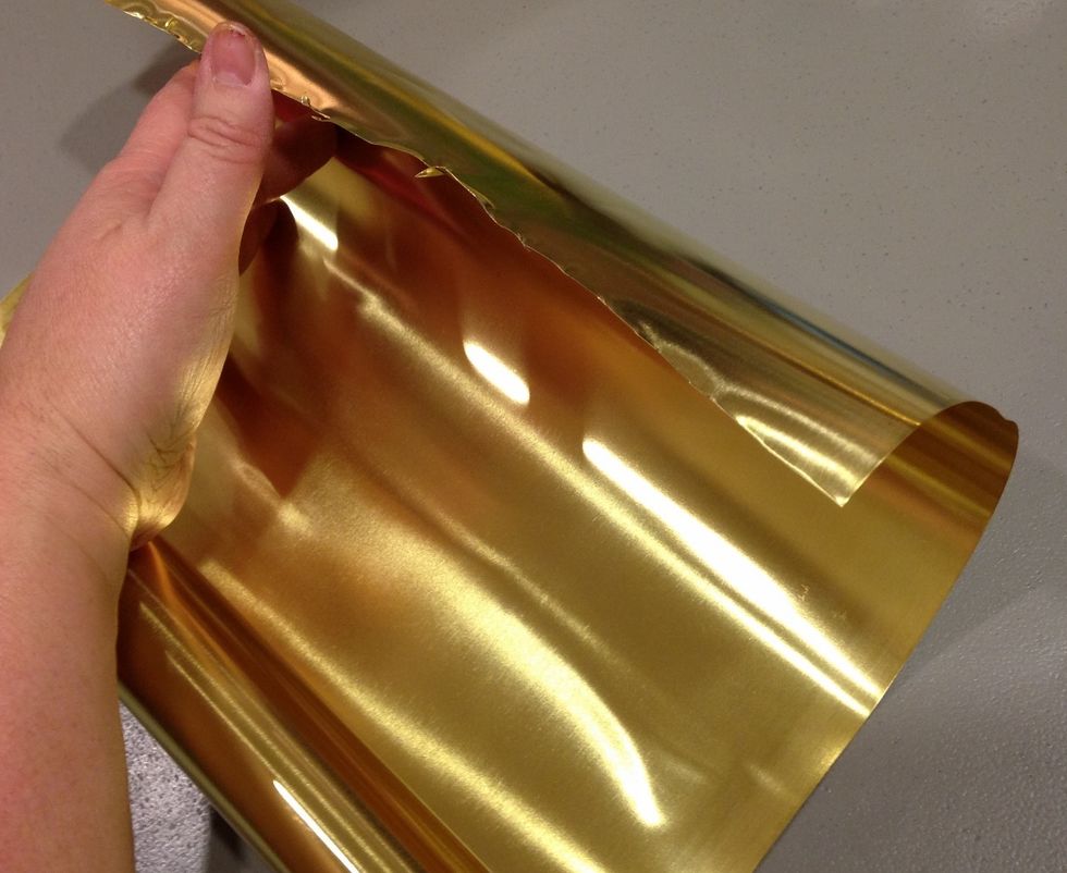 cut a piece of metal a little larger than your canvas. use tin snips or heavy scissors, work with gloves on and handle carefully, metal edges are SHARP!