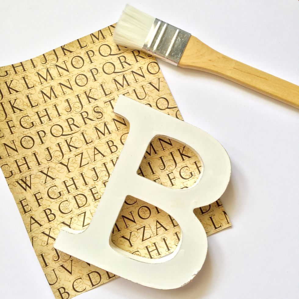 Cut a piece of paper bigger than the letter.